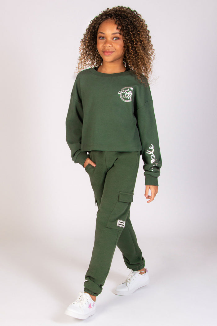 Skylar Blu dancer wearing Pineapple crop sweater and cargo joggers in khaki