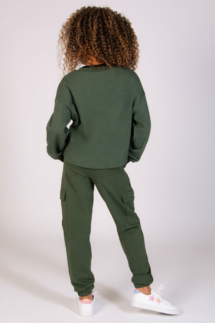 Girls' khaki dance outfit featuring cargo joggers and oversized sweat top