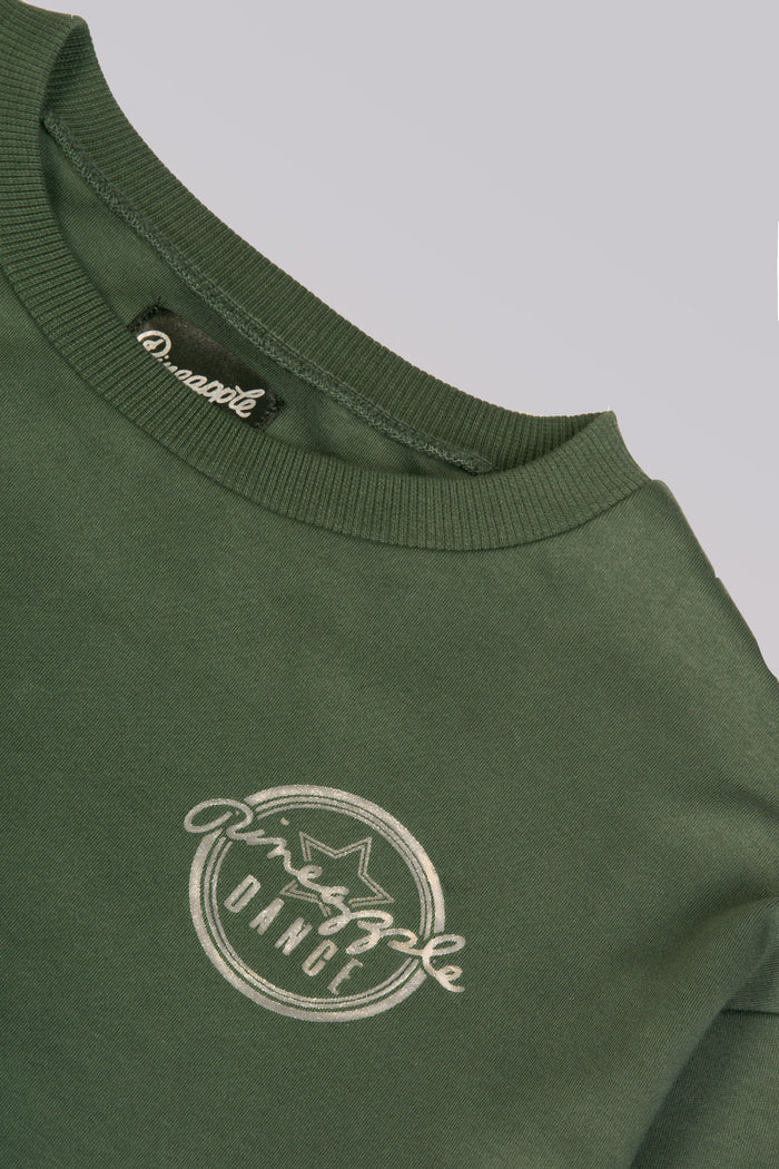 Detail shot of silver foil badge logo print on sweat top