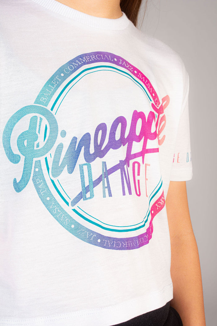 Kids' white crop top with colourful Pineapple logo.