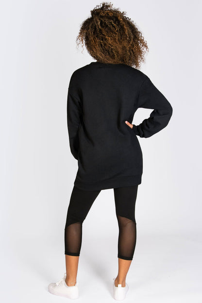 Longline sweat top in black in oversized fit for women.