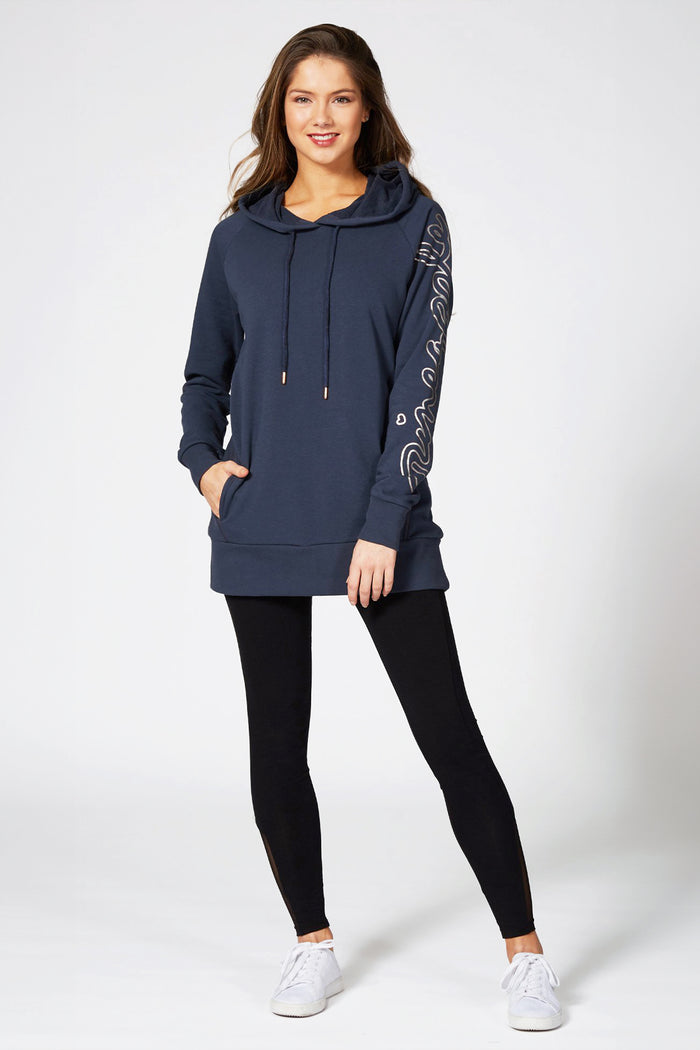 Kianna Louise modeling for Pineapple Dance Studios in longline logo hoodie