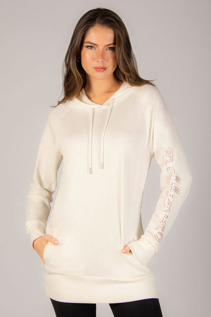 Women's cream longline hoodie with two hidden side pockets and adjustable hood.