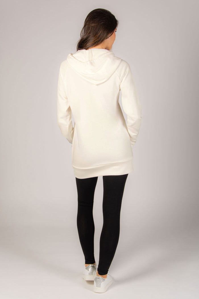 Cream long hoodie for women with spacious hood, perfect as loungewear.