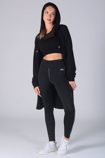 Woman wearing black Longline Zip Jacket and black leggings