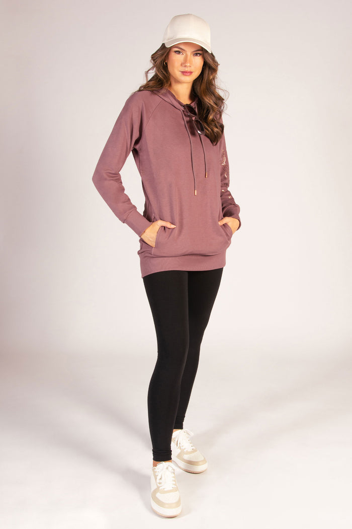 Kianna Louise wearing raisonette hoodie featuring concealed pockets and drawcords.