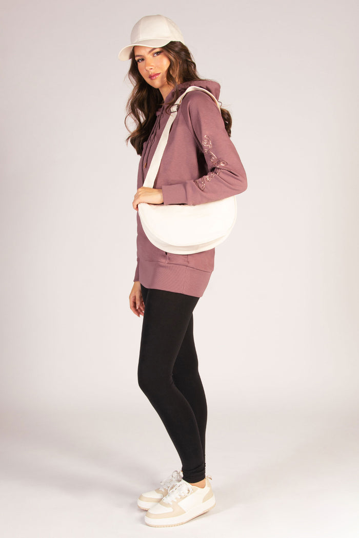 Women's athleisure outfit inspired by dance featuring Kianna Louise wearing raisonette hoodie.