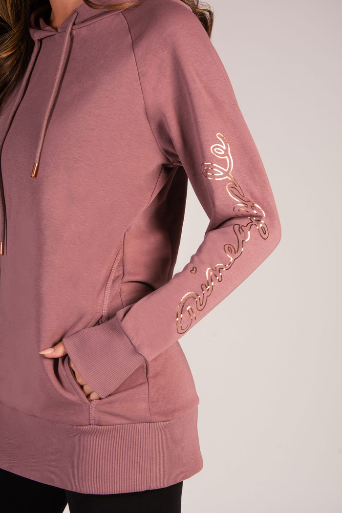 Delicate rose gold sleeve print and concealed side pockets on women's longline hoodie.