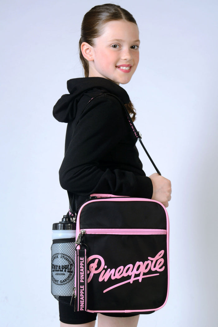 Girl carrying Pineapple black Lunch Bag