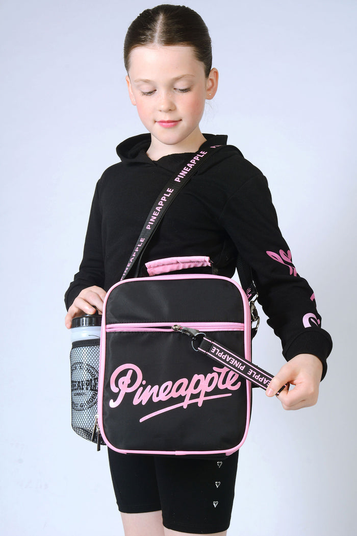 Girl carrying black Lunch Bag