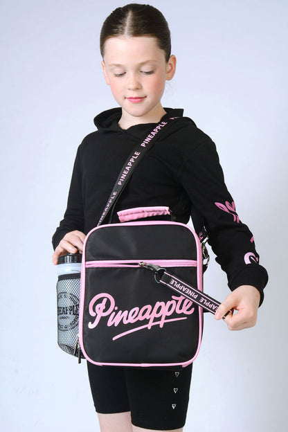 Girl carrying black Lunch Bag