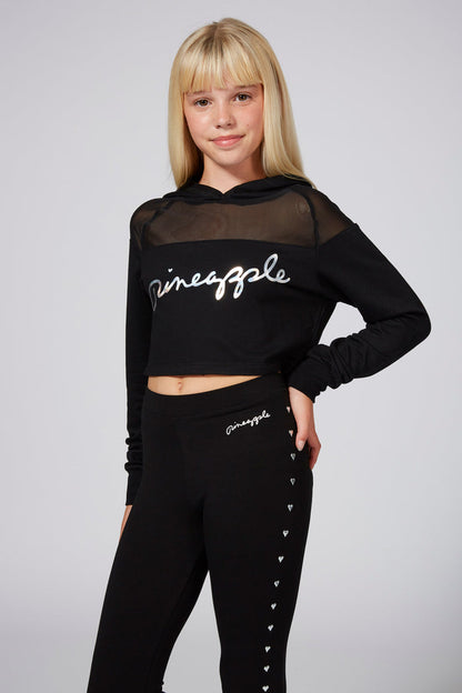 Girl wearing Black Mesh Panel Crop Hoodie and black leggings