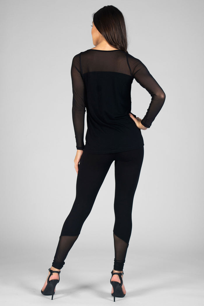 Woman wearing black Monroe Leggings with mesh panels and black Mesh Panel Top