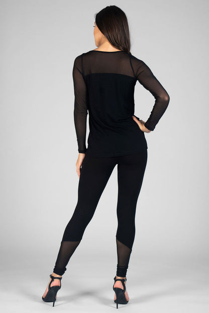 Woman wearing black Monroe Leggings with mesh panels and black Mesh Panel Top