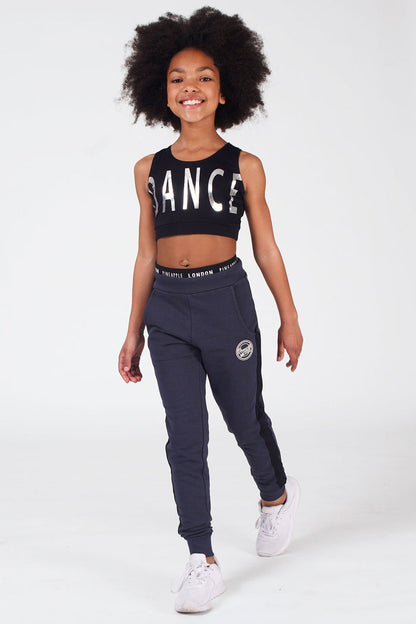 Girl wearing Charcoal Mesh Slim Trackpants and logo black crop top