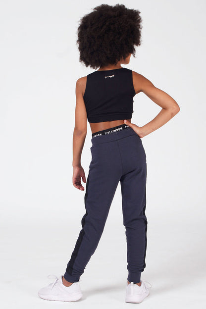 Girl wearing Charcoal Mesh Slim Trackpants and black crop top