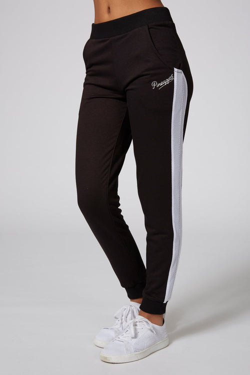 Girl wearing Pineapple Black Mesh Stripe Track Pants