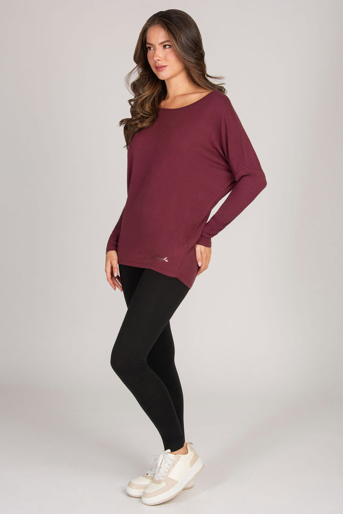 maroon long sleeve tunic top paired with black leggings