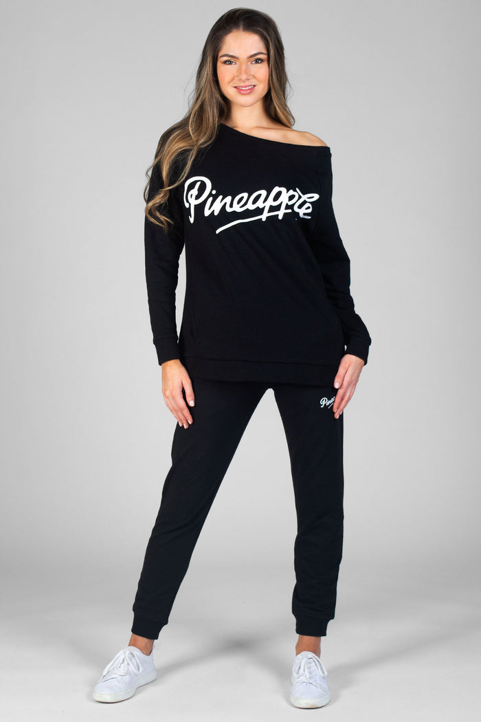 Woman wearing black Monster Sweatshirt and black Skinny Zip Joggers