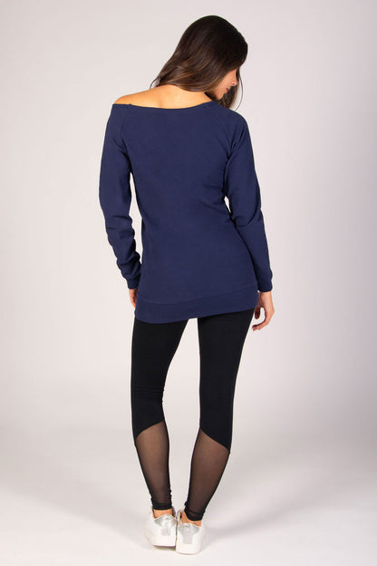 Women's dark navy longline sweater with off-shoulder neckline paired with mesh panel leggings.