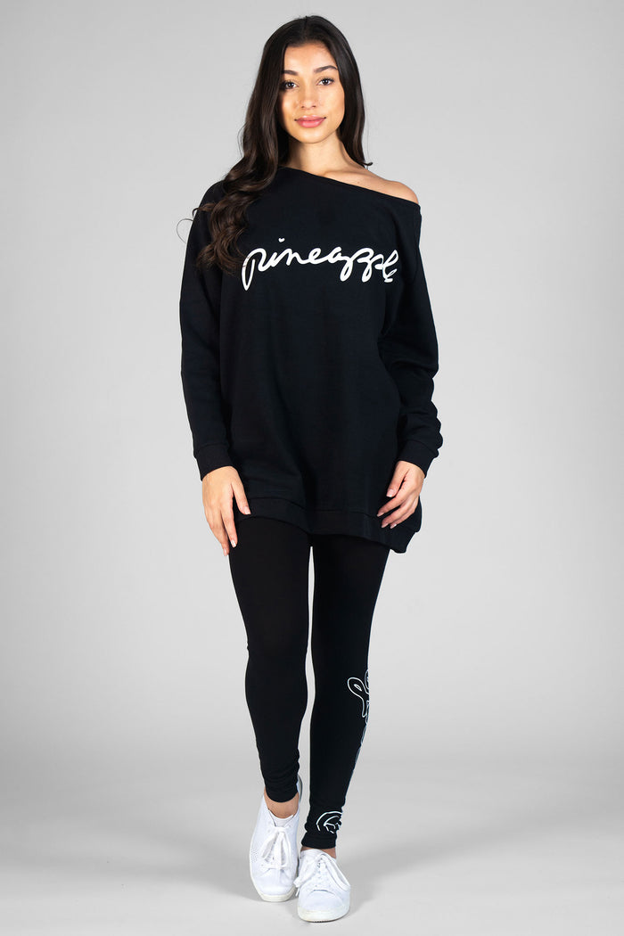 Woman wearing black Monster Monster Sweater and black Retro Logo Leggings