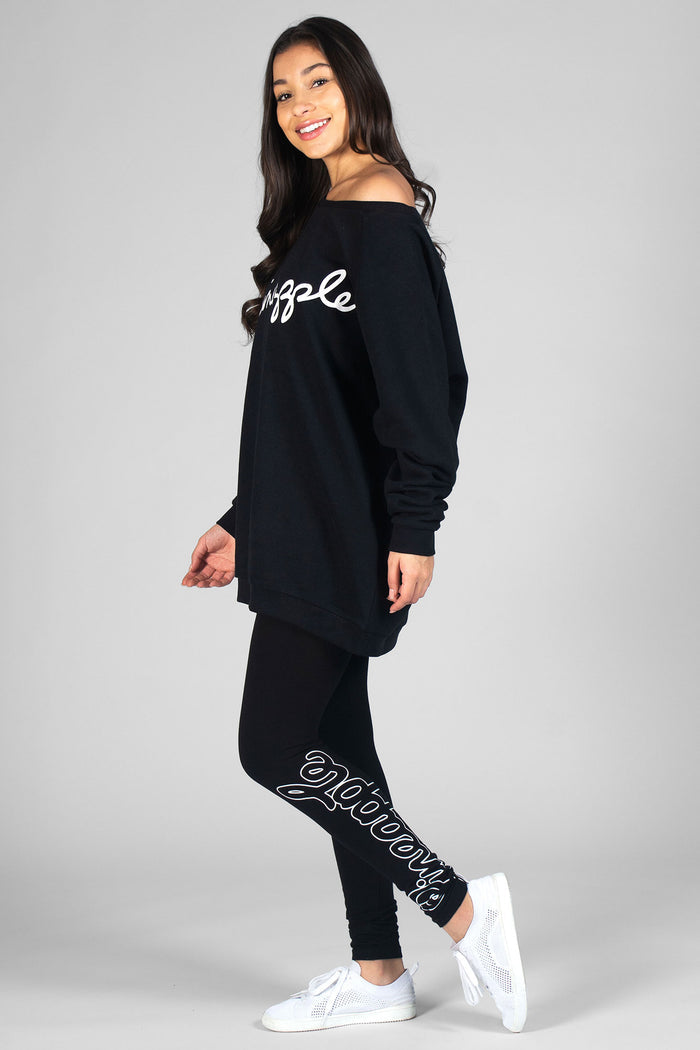 Woman wearing oversize black sweater and black Retro Logo Leggings