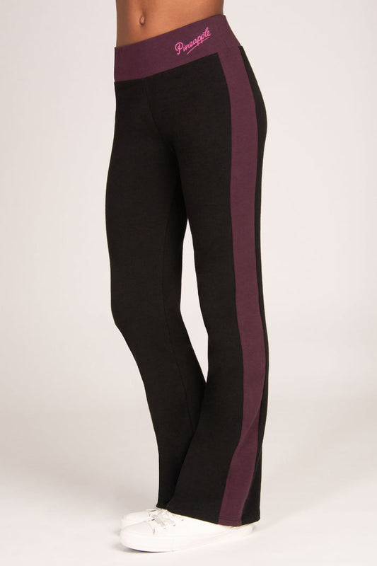Black flared leggings with maroon brown side panel and waistband on a white background