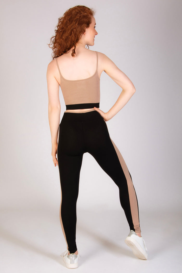 Women's panel leggings in blue and mocha paired with a midi crop top by Pineapple.