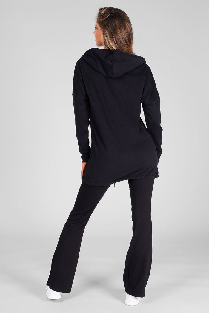 Woman wearing Black Parker Zip Long Length Jacket and Black Jacquard Jersey Trousers