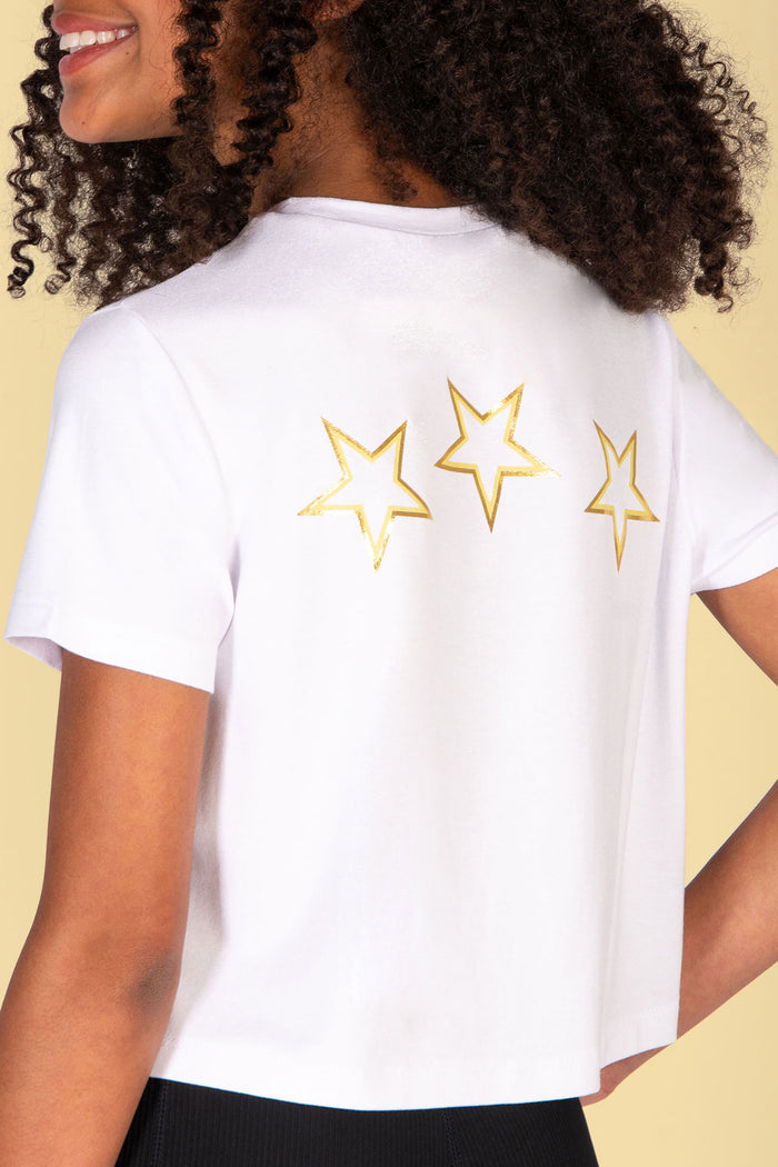 girls' white t-shirt with golden yellow stars print at the back