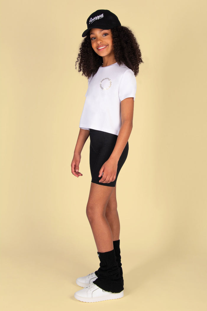 White crop t-shirt for girls with small silver foil and yellow print at the front.