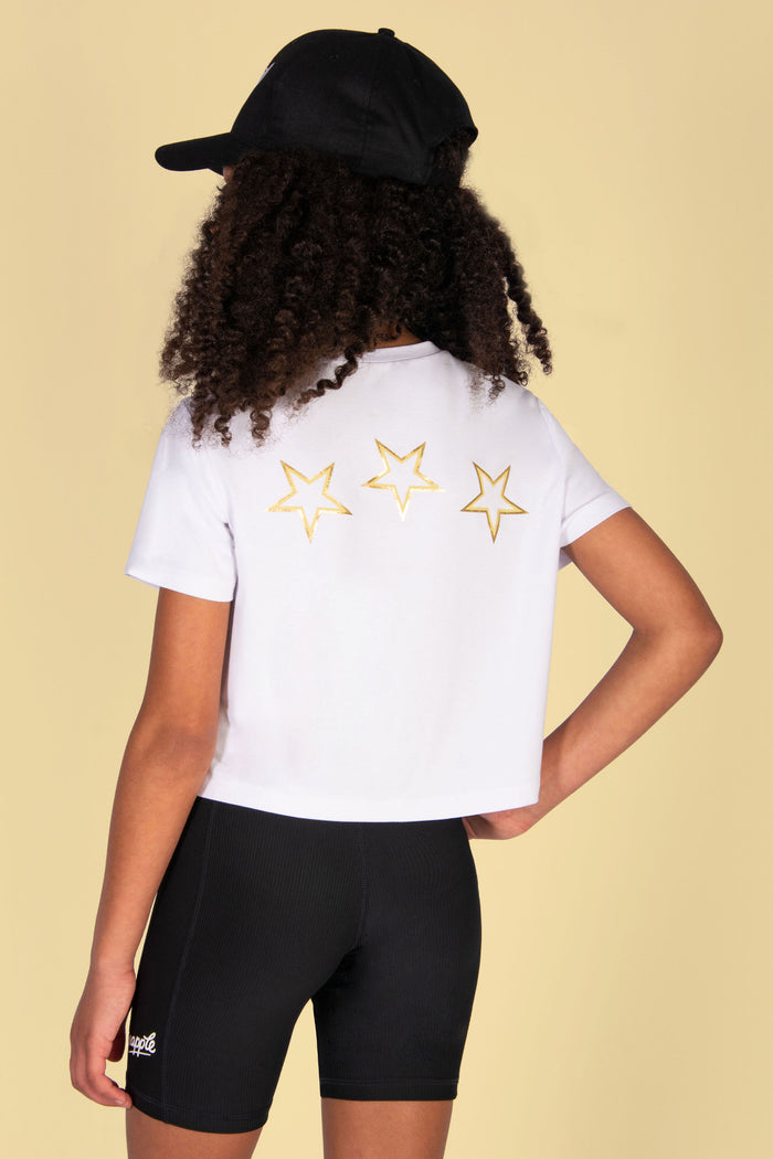 White t-shirt with yellow star print at the back of it.