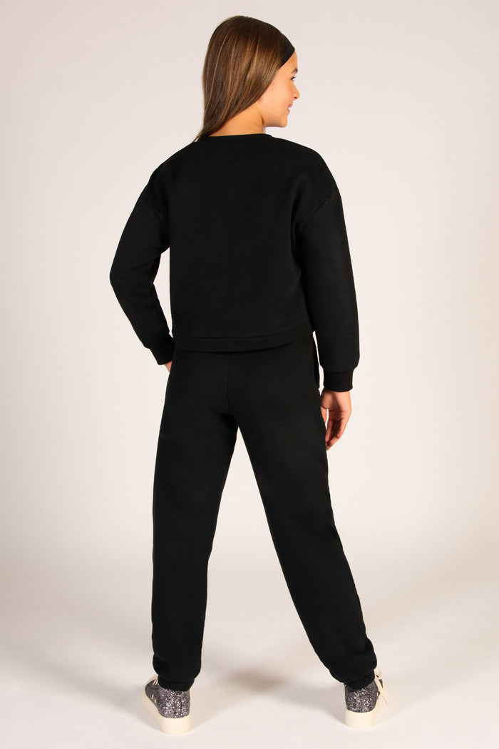 Black loungewear sweater for girls with matching basic black joggers.