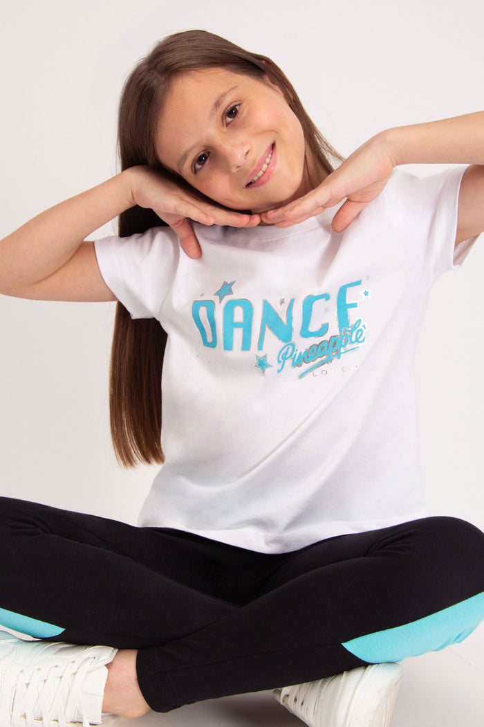 White dancer's t-shirt with turquoise star print featuring London logo.