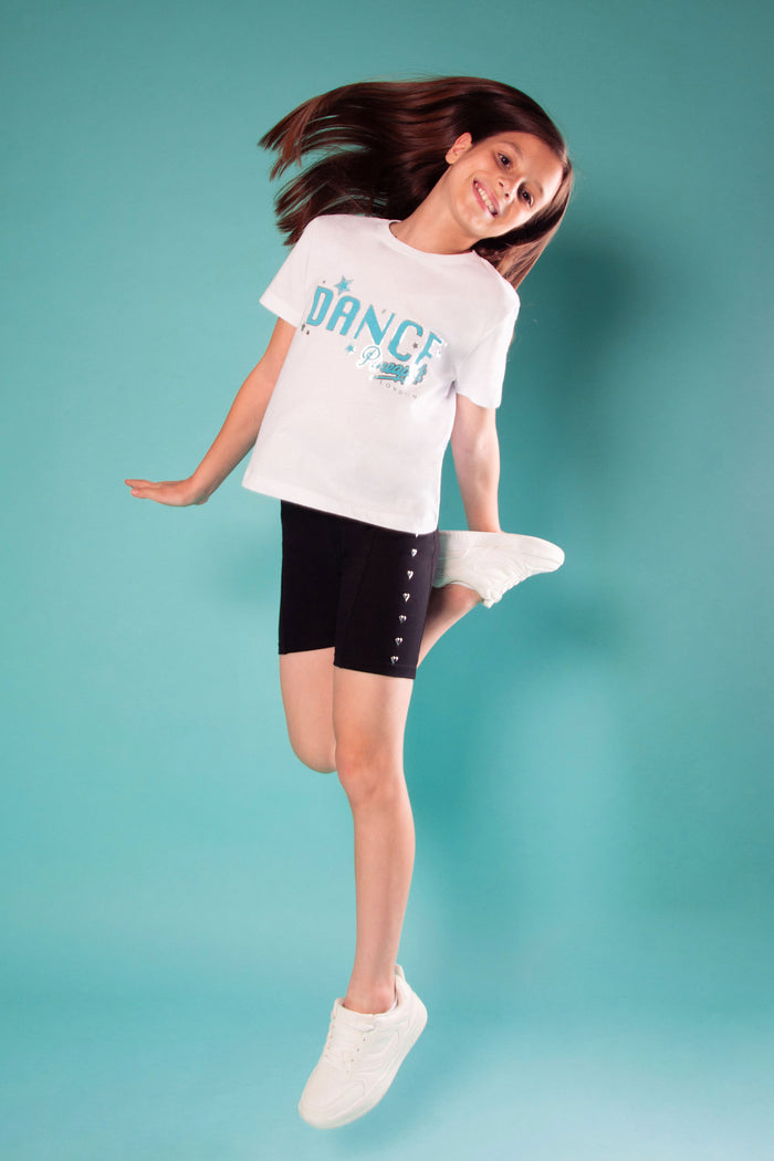 Young dancer's top in white with light blue 'DANCE' print across the chest.