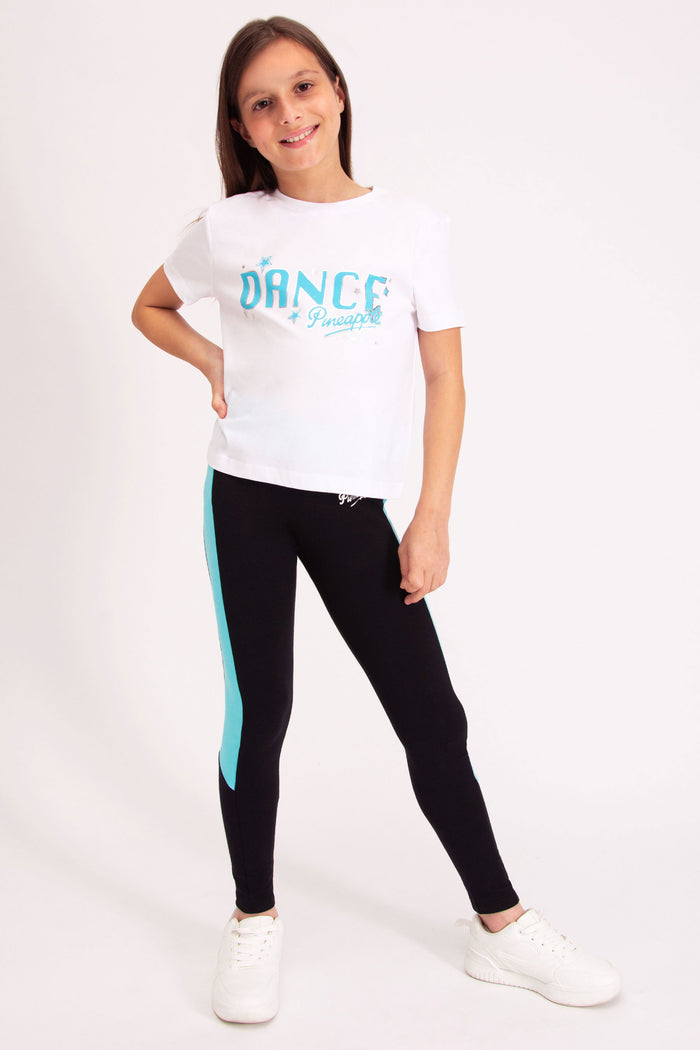 Pineapple Dance Studios white t-shirt decorated with stars and turquoise chest print.