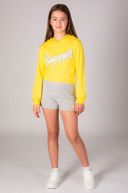 Girls' yellow hoodie with Pineapple Dance Studios chest logo print.