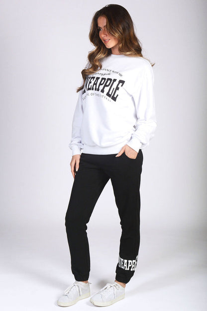 Pineapple black joggers with white oversized logo sweatshirt worn by Kianna Louise