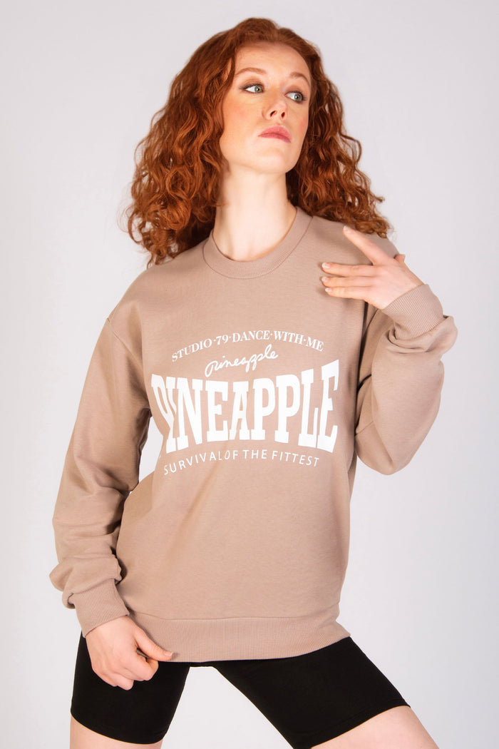 Light brown oversized sweat top for women with Pineapple logo across the chest