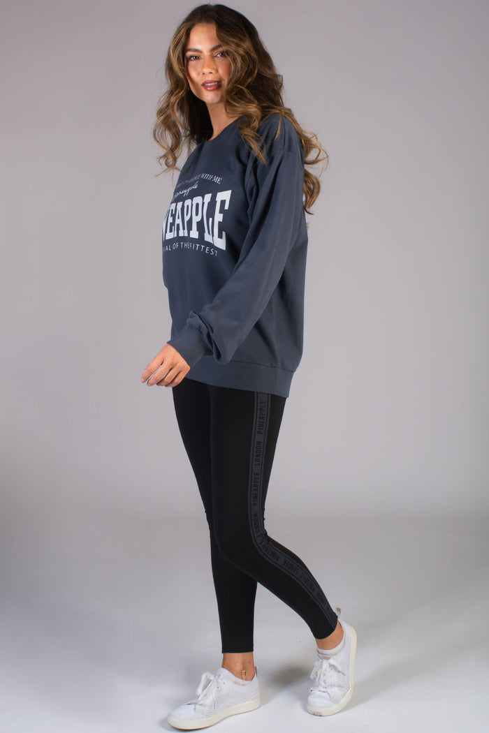 Kianna Louise, miss bikini 2023 wearing Pineapple matching set of unisex oversized sweatshirt and basic black leggings