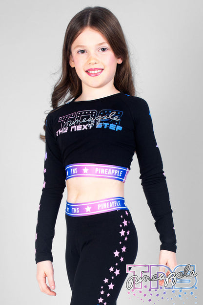 Girl wearing black TNS Long Sleeve Crop Top