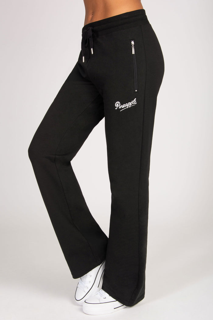 Black sweatpants with zip pockets a brand logo on a white background