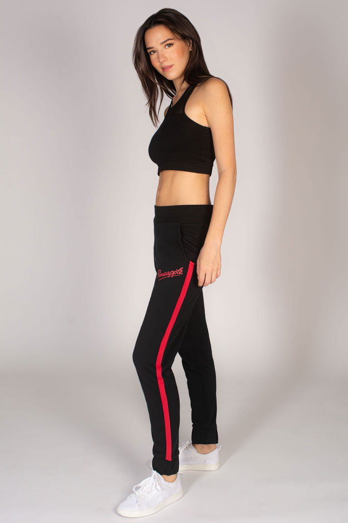 Martyna Balsam wearing black joggers by Pineapple paired with black mesh sports bra.