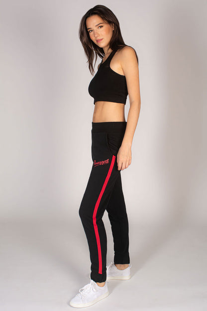 Martyna Balsam wearing black joggers by Pineapple paired with black mesh sports bra.