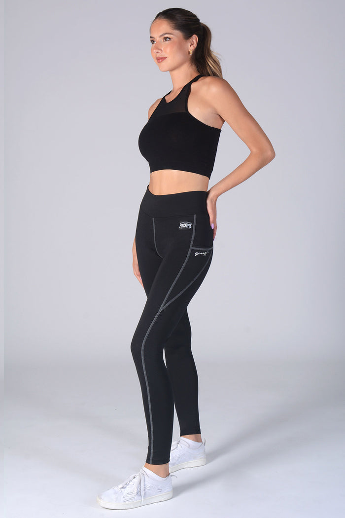 Woman wearing black Leggings with pockets and black Monroe vest top