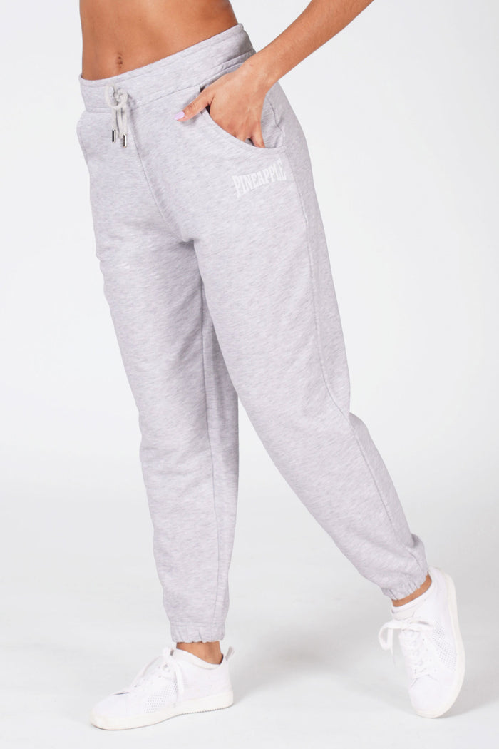 Woman wearing grey Pineapple oversized pocket joggers.