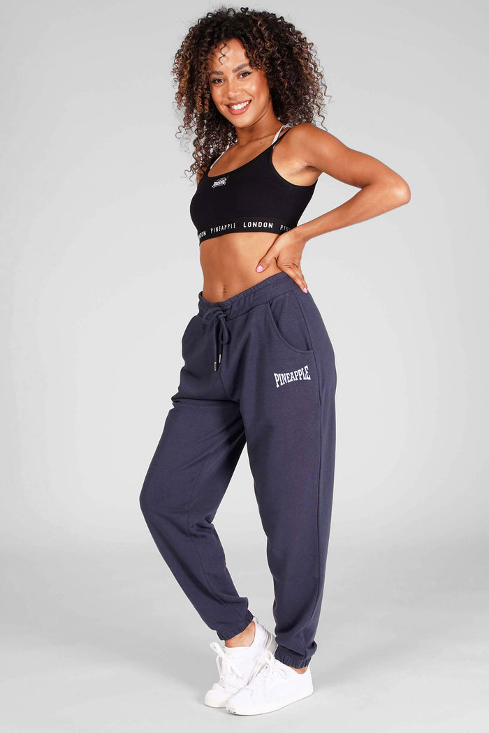 Woman wearing Charcoal Oversized Pocket Joggers and Black Bra Top