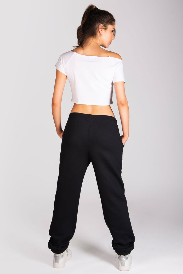 Women's dance crop t-shirt in white paired with oversized joggers.