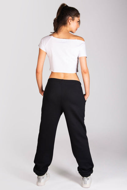 Women's dance crop t-shirt in white paired with oversized joggers.