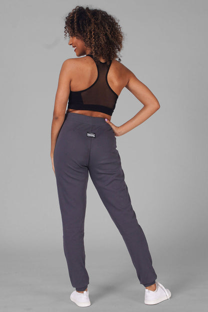Woman wearing charcoal Retro Skinny Trousers and Cropped Vest with mesh back